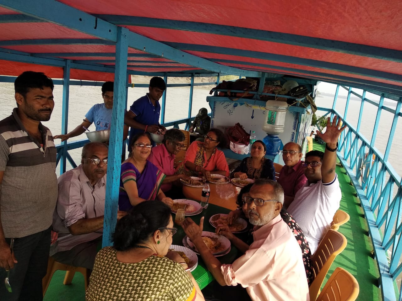 People eating food on boat in Sunderban